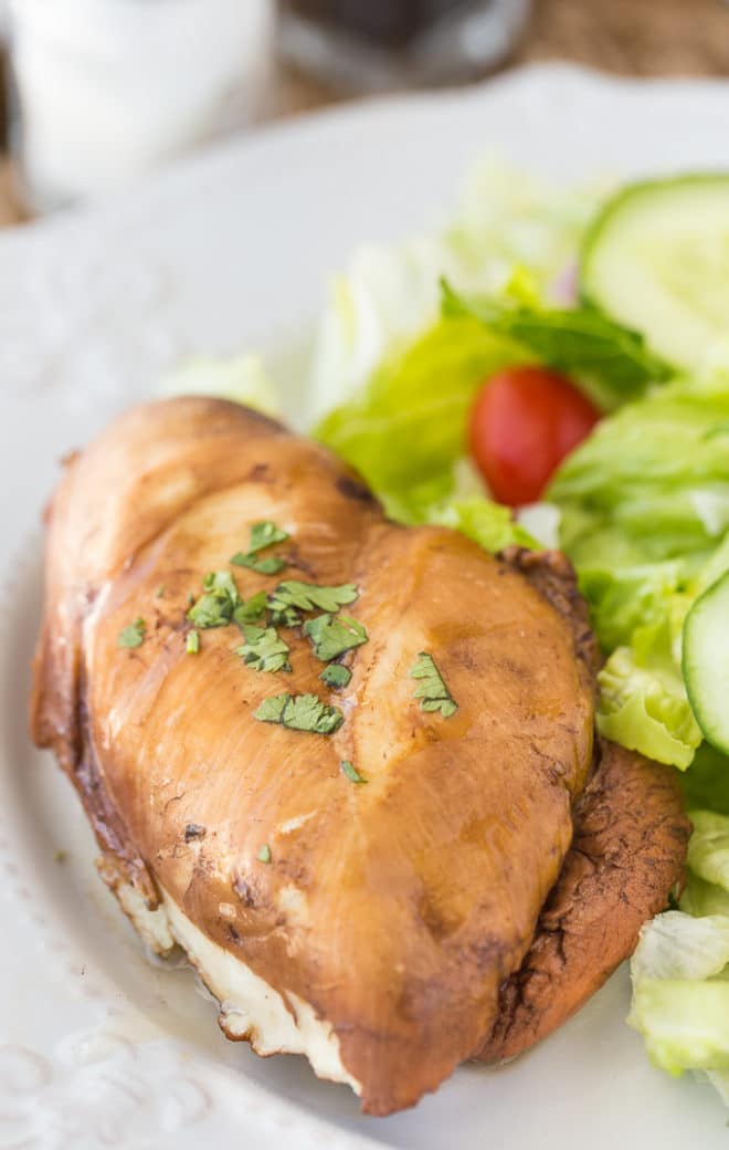 Chicken marinated in pantry staples like tea, honey, and soy sauce beside lettuce.