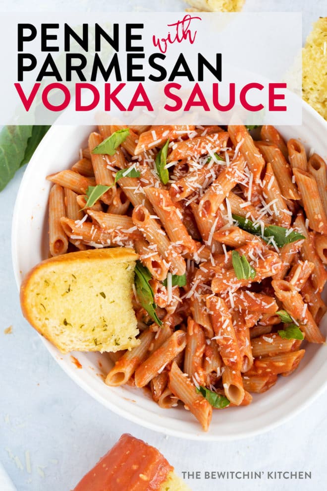 Close up of penne pasta with a tomato vodka sauce with parmesan and basil.