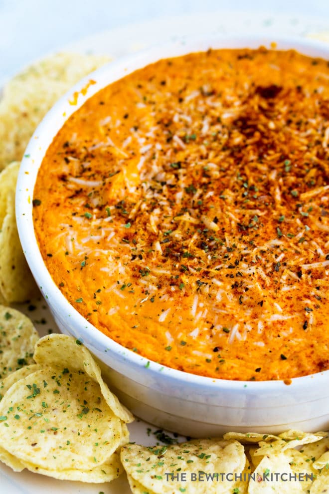 Buffalo chicken dip in a round baker with tostitos