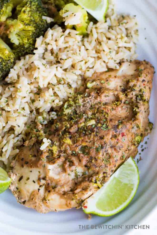 Broccoli, rice, and chicken breast cooked in a crockpot with a thai peanut sauce.