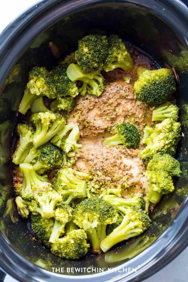 Broccoli and chicken in a peanut butter sauce cooked in a slow cooker.