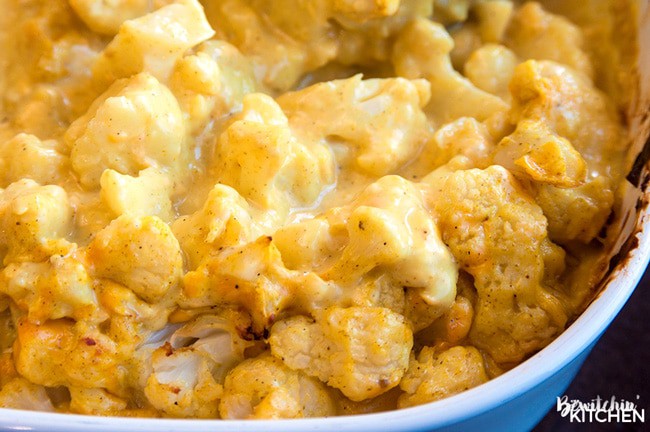 curried cauliflower in a blue casserole dish