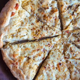 Italian Pizza Bread - this was my favorite appetizer recipe growing up! Soft pizza crust with zesty italian salad dressing, garlic, parmesan and mozzarella. Yum!