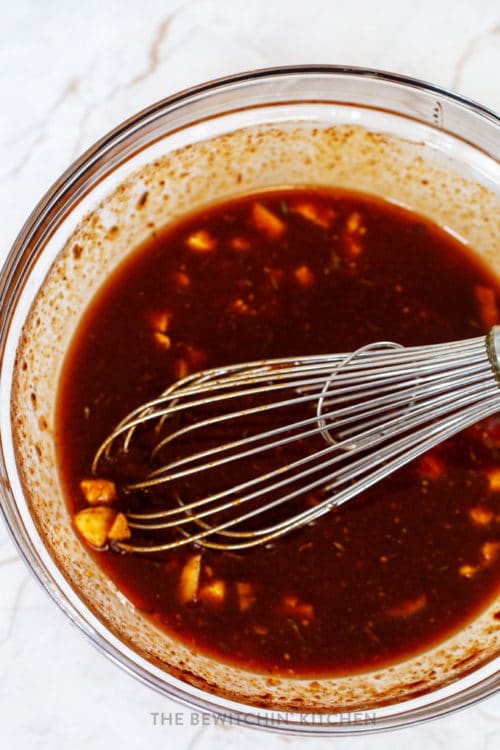 bowl of bbq sauce for pulled pork with a whisk stirring it