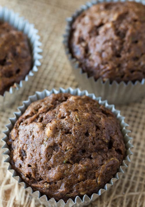 Overhead shot of chocolate muffins with pecans and zucchini.