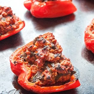 Paleo stuffed peppers recipe. This recipe is the most popular post at The Bewitchin' Kitchen. Add it to your paleo recipes list! | Turkey Stuffed Peppers #Paleo recipe