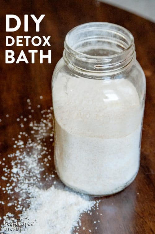 A mason jar with a DIY detox bath recipe that helps ease flu symptoms.