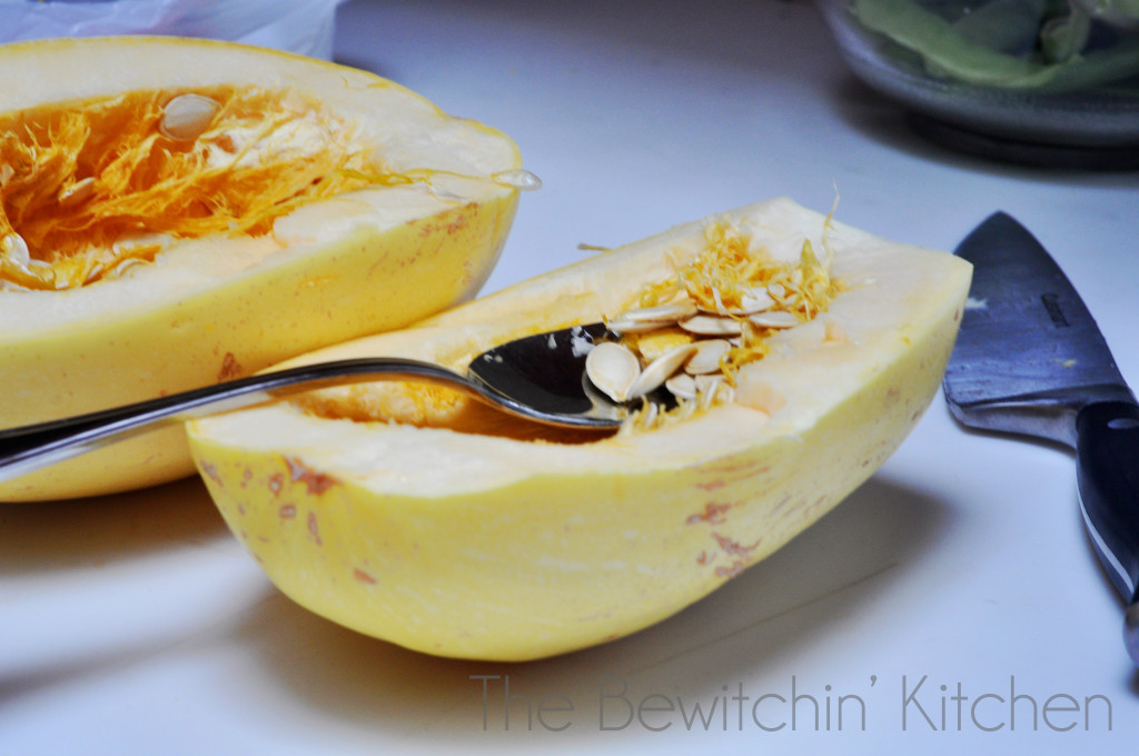 Seeding spaghetti squash. Texas Turkey Spaghetti Squash Bake: A gluten free and paleo recipe that is not only filling and delicious but MAN APPROVED as well. Spaghetti squash recipes are a great way to add in some extra vegetables for your family. | The Bewitchin' Kitchen