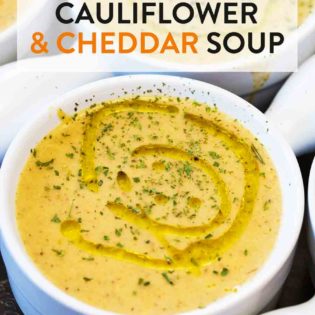 A bowl full of roasted cauliflower cheddar soup