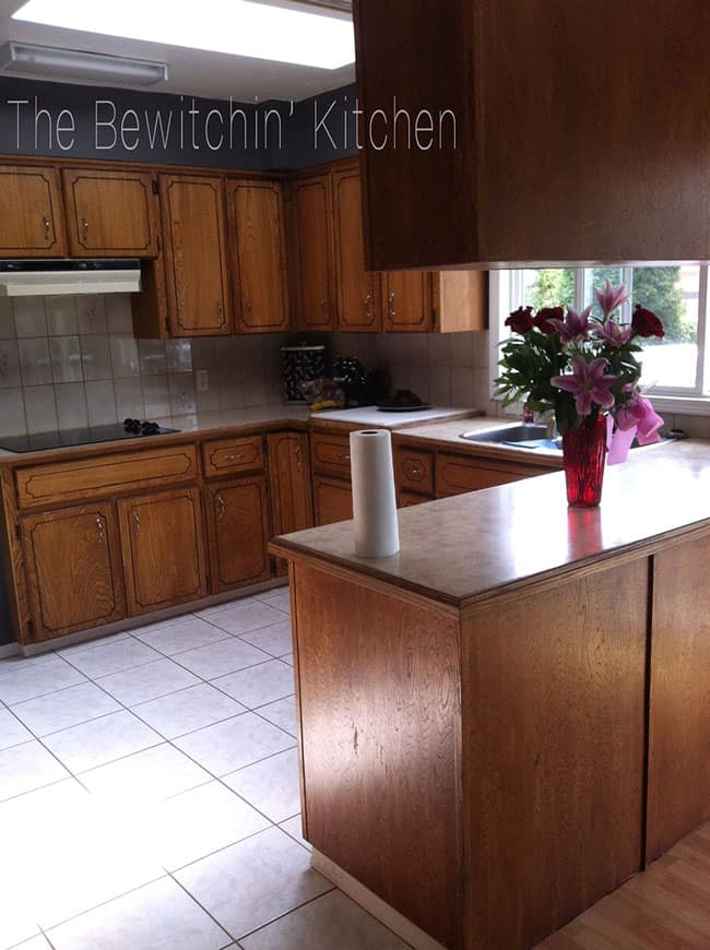 Transforming a 45 year old kitchen just by painting kitchen cabinets. This dated kitchen had old, oak cabinets that needed a little life. Products used: INSL-X Cabinet coat tinted in Benjamin Moore Chantilly Lace. Nothing like a little DIY renovation to spruce up kitchen cupboards..