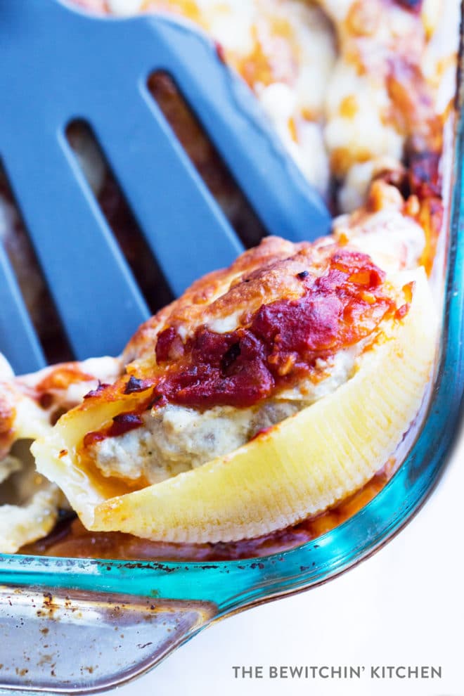 Ricotta Stuffed Shells being lifted by a spatula