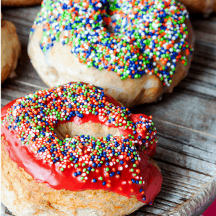 Baked Donuts with a maple glaze from TheBewitchinKitchen.com. What a fun dessert recipe to make with the kids!