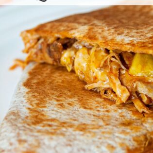 This pulled pork quesadilla is a delicious slow cooker recipe made with a mexican twist! | The Bewitchin' Kitchen