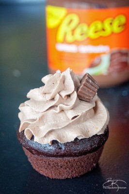 The PMS Buster - Chocolate Peanut Butter Filled Cupcakes with the world's best buttercream recipe: Chocolate Peanut Butter Frosting. Must try dessert recipe!