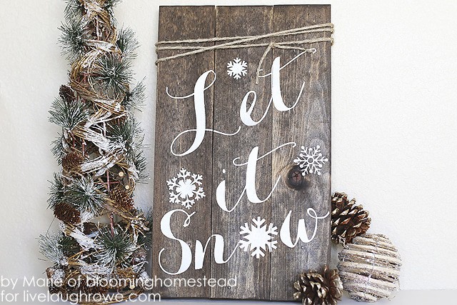 12 Enchanting DIY Christmas Decor Ideas: Bring nature indoors with this DIY Woodland Sign from Live Laugh Rowe.