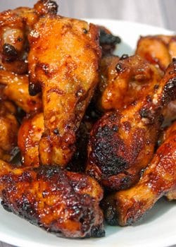 Sweet Sriracha Chicken Wings - this chicken wing recipe is the perfect blend of sweet and spicy. My husband asked me if he could go to the store, to buy more wings so I could make MORE of these tonight! Perfect for game day! | thebewitchinkitchen.com