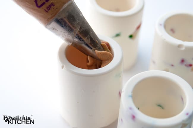 Chocolate Shot Glass with a Gingerbread Cheesecake Filling, these may be the coolest things I have ever made and they're such an easy no bake dessert too! | thebewitchinkitchen.com