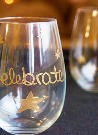 These DIY Gold Wine Glasses are a simple and easy craft. They make a great host or hostess gift and are perfect for sipping wine during the Christmas holidays and new years. | thebewitchinkitchen.com