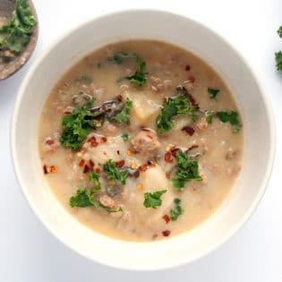 Paleo Zuppa Toscana Soup - an easy and simple paleo twist on a classic soup recipe. It's so creamy and delicious! Perfect for chilly winter nights. | thebewitchinkitchen.com