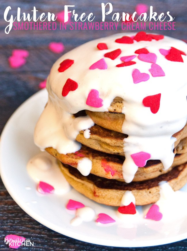 Gluten free pancakes smothered in a strawberry greek yogurt cream cheese sauce. This gluten free pancake recipe is so fluffy and yummy! A healthy breakfast packed with flavor. | thebewitchinkitchen.com