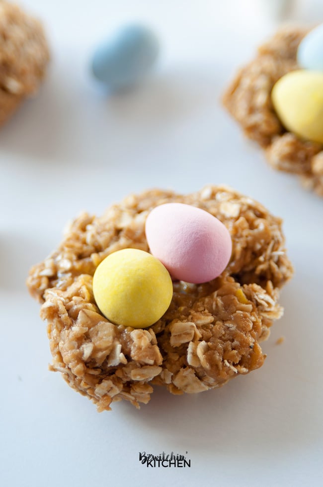 Nut Free Easter Nest Bites - this no bake dessert is such an easy recipe. Quick oats, brown rice syrup, candy coated chocolate eggs (Mini Eggs or Eggies) and sunflower seed butter. | thebewitchinkitchen.com