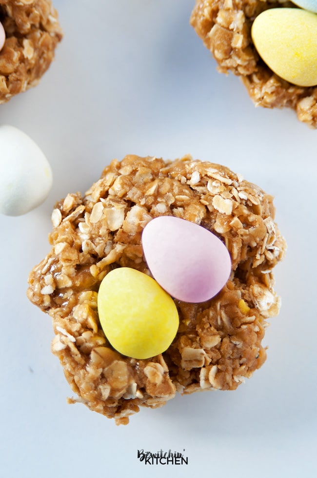 Nut Free Easter Nest Bites - this no bake dessert is such an easy recipe. Quick oats, brown rice syrup, candy coated chocolate eggs (Mini Eggs or Eggies) and sunflower seed butter. | thebewitchinkitchen.com