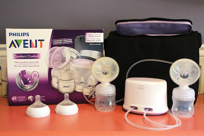 Avent Breast Pump kit in front of box. Includes 2 nipples, 2 bottles, 2 flanges, pump, and carrying case 