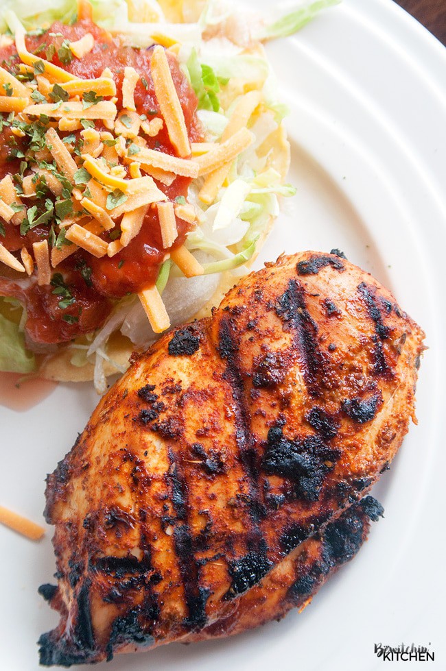 Try this recipe at your next BBQ! Barbecued Tex Mex Chicken, a healthy bbq recipe that is full on flavor! I love the southern flavors of chili, cumin and the twist with brown sugar. Serve with a tostada topped with lettuce, cheddar cheese, greek yogurt and salsa. PS - it's 21 Day Fix approved!