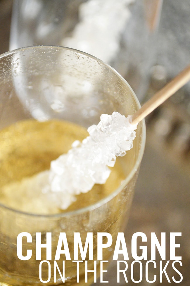 This champagne on the rocks idea is an elegant way to glam up your party (or Friday night). Perfect New Years Eve Party Idea. It's so easy too: sparkling wine and rock candy! An easy and low cost way to add class to your party.