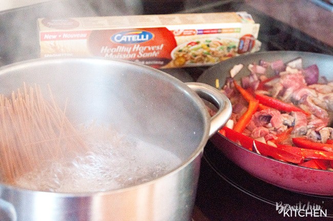 Healthy Steak Stir Fry - this man approved 21 day fix recipe has steak strips, broccoli, red pepper, red onions all tossed together stir fry style and served over ancient grain noodles. It's a fast and easy recipe that's good for you. | thebewitchinkitchen.com