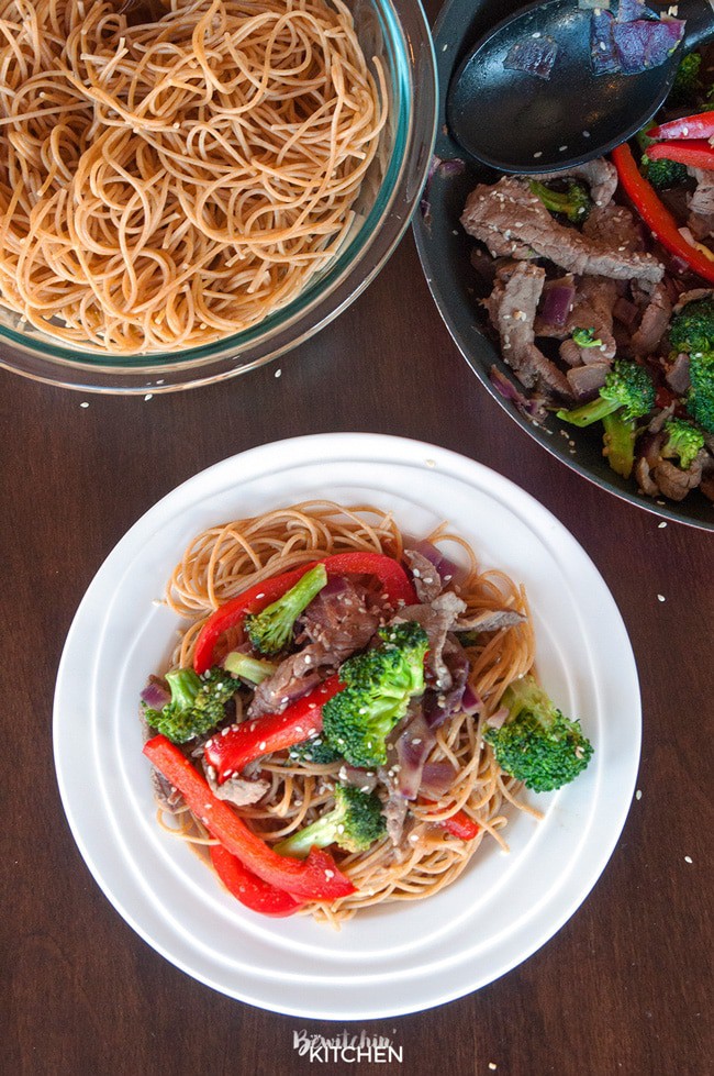 Healthy Steak Stir Fry - this man approved 21 day fix recipe has steak strips, broccoli, red pepper, red onions all tossed together stir fry style and served over ancient grain noodles. It's a fast and easy recipe that's good for you. | thebewitchinkitchen.com