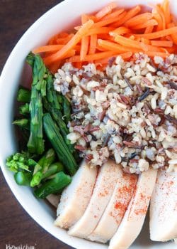 Spring Chicken Bowls with Honey Dijon Dressing - this healthy recipe makes the perfect lunch, snack or dinner. Loaded with roasted red pepper, grilled chicken breast, matchstick carrots, steamed asparagus, quinoa blend and topped with a healthy dressing. This recipe is 21 Day Fix approved. #chickendotca | thebewitchinkitchen.com