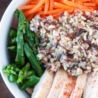 Spring Chicken Bowls with Honey Dijon Dressing - this healthy recipe makes the perfect lunch, snack or dinner. Loaded with roasted red pepper, grilled chicken breast, matchstick carrots, steamed asparagus, quinoa blend and topped with a healthy dressing. This recipe is 21 Day Fix approved. #chickendotca | thebewitchinkitchen.com