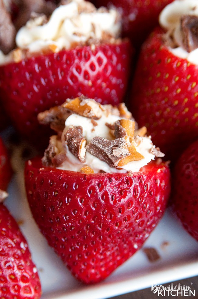 Rum Cheesecake Stuffed Strawberries. This easy, no bake dessert recipe is a party favorite. Cream cheese, sugar and rum extract, topped with crunchy milk chocolate covered pretzels makes this bite sized treat sweet, salty and crunchy. Add this to your popular desserts board.