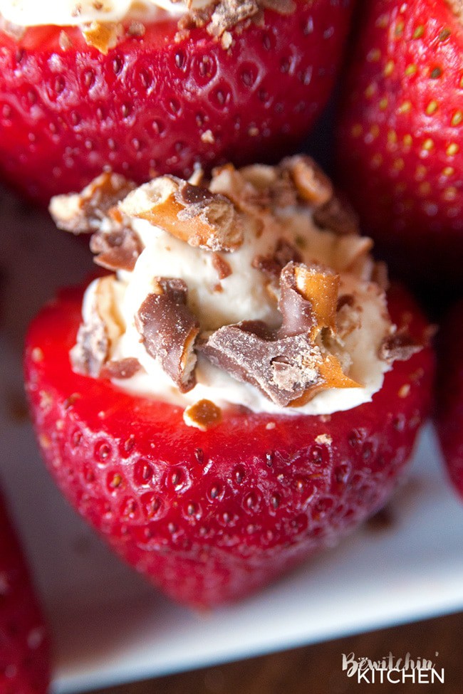 Cheesecake Stuffed Strawberries. This easy, no bake dessert recipe is a party favorite. Cream cheese, sugar and vanilla, topped with crunchy milk chocolate covered pretzels makes this bite sized treat sweet, salty and crunchy. Add this to your popular desserts board.