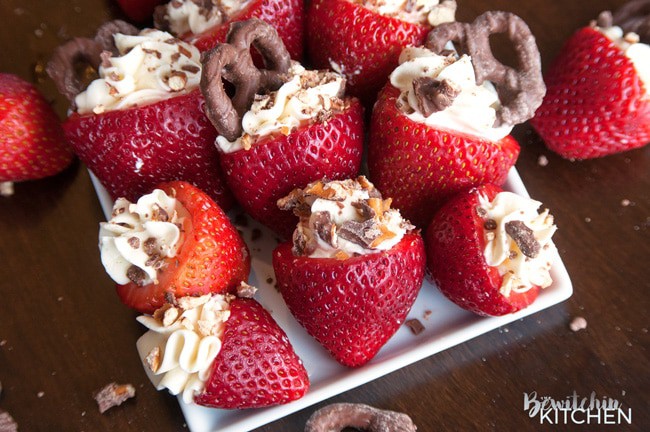 Cheesecake Stuffed Strawberries. This easy, no bake dessert recipe is a party favorite. Cream cheese, sugar and vanilla, topped with crunchy milk chocolate covered pretzels makes this bite sized treat sweet, salty and crunchy. Add this to your popular desserts board.