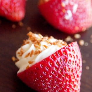 OMG Coconut Cheesecake Stuffed Strawberries! This dessert recipe is amazing! It's fast, easy and I love the crunch to the toasted coconut. Must make these for upcoming bridal showers and baby showers. Delicious party dessert idea!