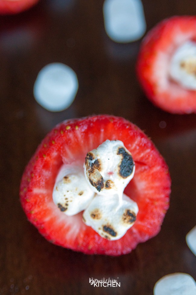 Smores Stuffed Strawberries. An easy dessert recipe that can be enjoyed around the campfire, bbq or all year long!
