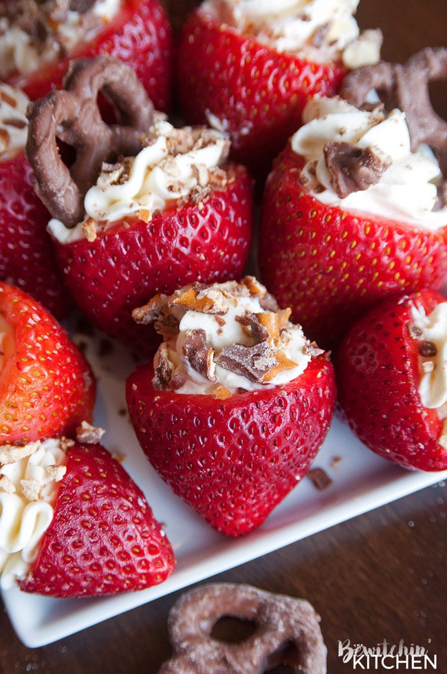 Rum Cheesecake Stuffed Strawberries. This easy, no bake dessert recipe is a party favorite. Cream cheese, sugar and rum extract, topped with crunchy milk chocolate covered pretzels makes this bite sized treat sweet, salty and crunchy. Add this to your popular desserts board.