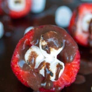 Smores Stuffed Strawberries. An easy dessert recipe that can be enjoyed around the campfire, bbq or all year long!