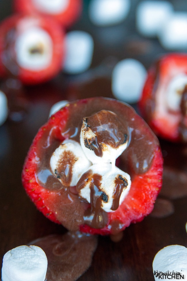 Smores Stuffed Strawberries. An easy dessert recipe that can be enjoyed around the campfire, bbq or all year long!