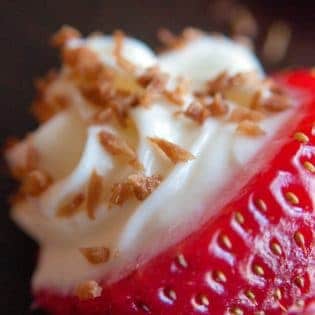 OMG Coconut Cheesecake Stuffed Strawberries! This dessert recipe is amazing! It's fast, easy and I love the crunch to the toasted coconut. Must make these for upcoming bridal showers and baby showers. Delicious party dessert idea!