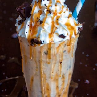 Dairy Free Chocolate Salted Caramel Milkshake. This dairy free milkshake uses cashew milk ice cream and coconut milk. Top with coconut whipped cream, caramel sauce and shaved dark chocolate. Super yummy dessert drink!