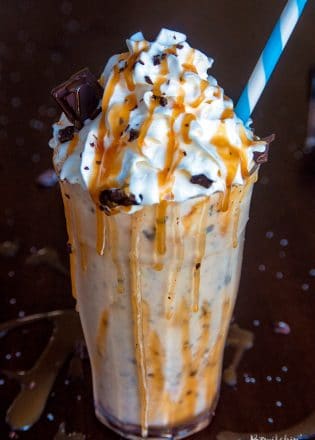 Dairy Free Chocolate Salted Caramel Milkshake. This dairy free milkshake uses cashew milk ice cream and coconut milk. Top with coconut whipped cream, caramel sauce and shaved dark chocolate. Super yummy dessert drink!