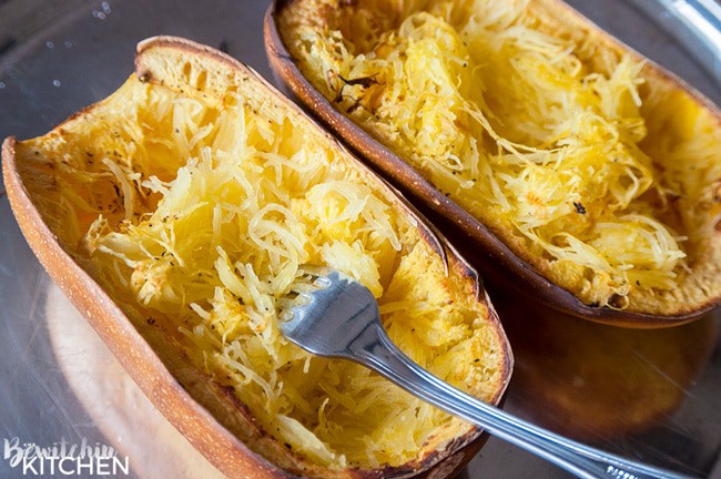 Tomato Pesto Spaghetti Squash Bake - this 21 Day Fix recipe is a gluten free and low carb dinner favorite. It's packed with fire roasted tomatoes, pesto, mozzarella and parmesan cheese and a few servings of vegetables.