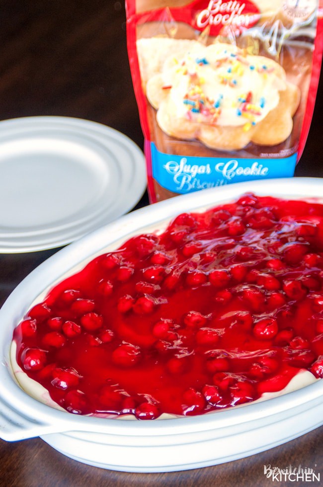 This easy cherry cheesecake recipe is the perfect summer dessert. Using a sugar cookie crust, a no bake cheesecake recipe and cherry pie filling it's a delicious dessert for summer bbqs without the work! | thebewitchinkitchen.com