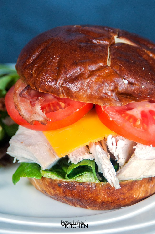 Chicken Club Pretzel Bun Sandwich - This sandwich recipe was inspired by Swiss Chalet's Chicken Club Kaiser. This is perfect for lunch, dinner or a snack and I LOVE the pesto mayo. It's an easy recipe to make if you have some pre-cooked chicken ready to go, perfect for leftovers with a twist.