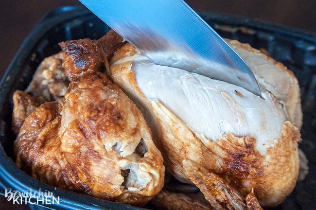 rotisserie chicken being cut into