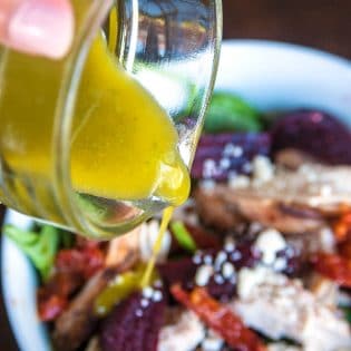 Pesto Vinaigrette - a delicious, tangy yet sweet salad dressing. This 21 day fix approved vinaigrette is a favorite homemade salad vinaigrette recipe.