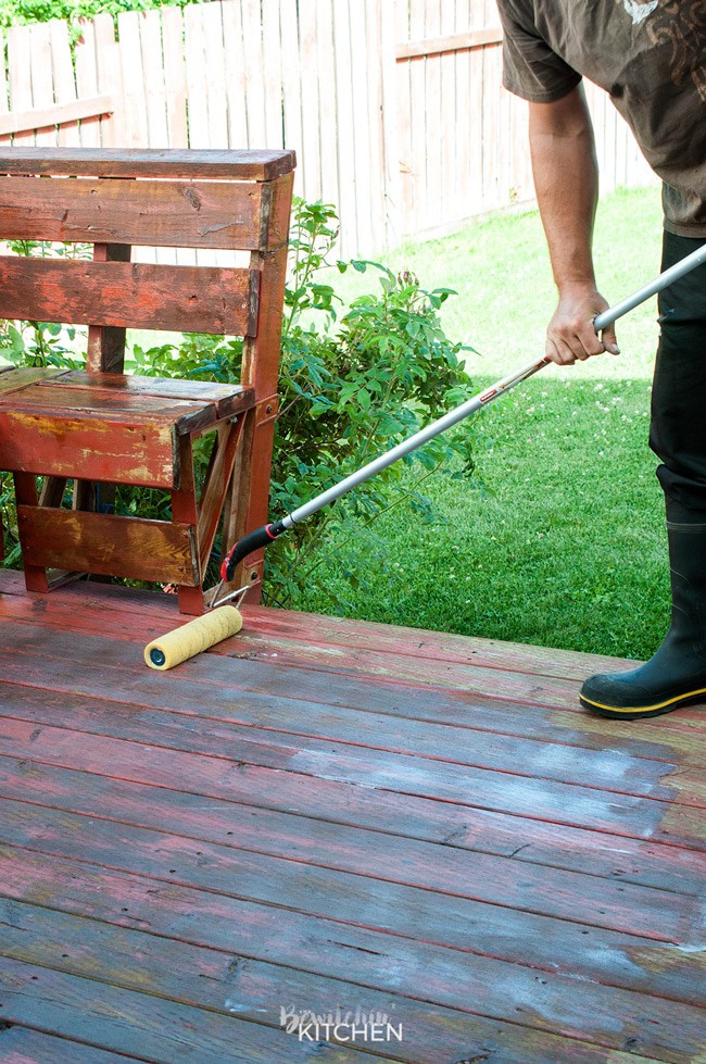 How to stain a deck in 4 easy steps. This DIY deck renovation uses Behr's Premium Deck Stripper, Wood Cleaner and Semi-Transparent Stain in Redwood Naturaltone. The before and after looks incredible!